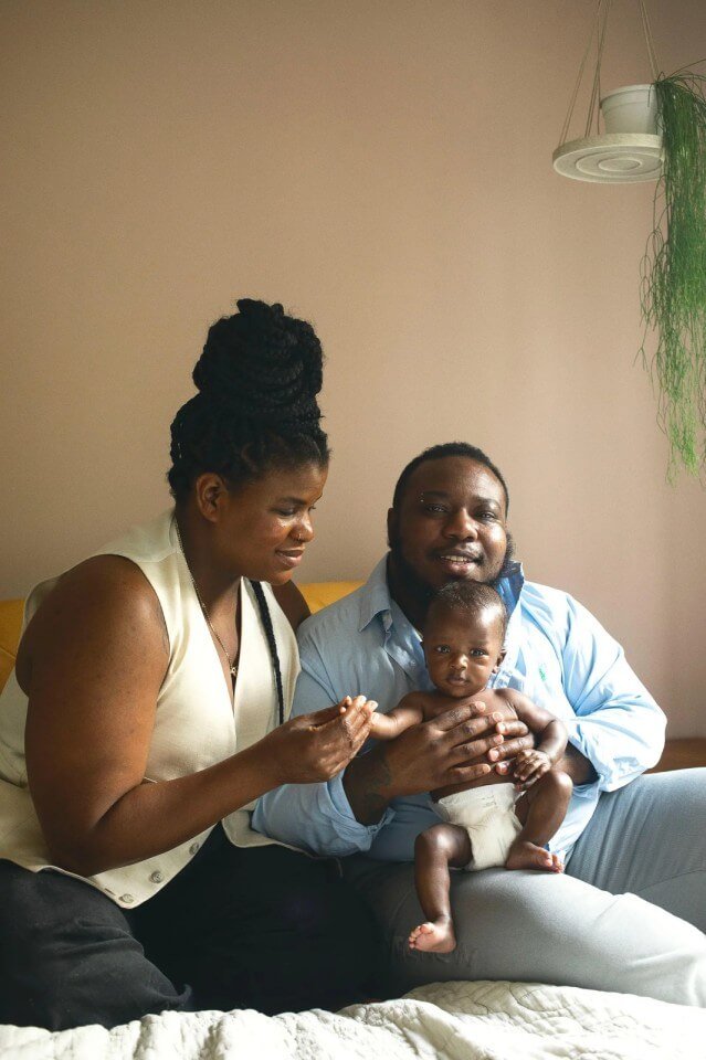 A couple at home with their new baby