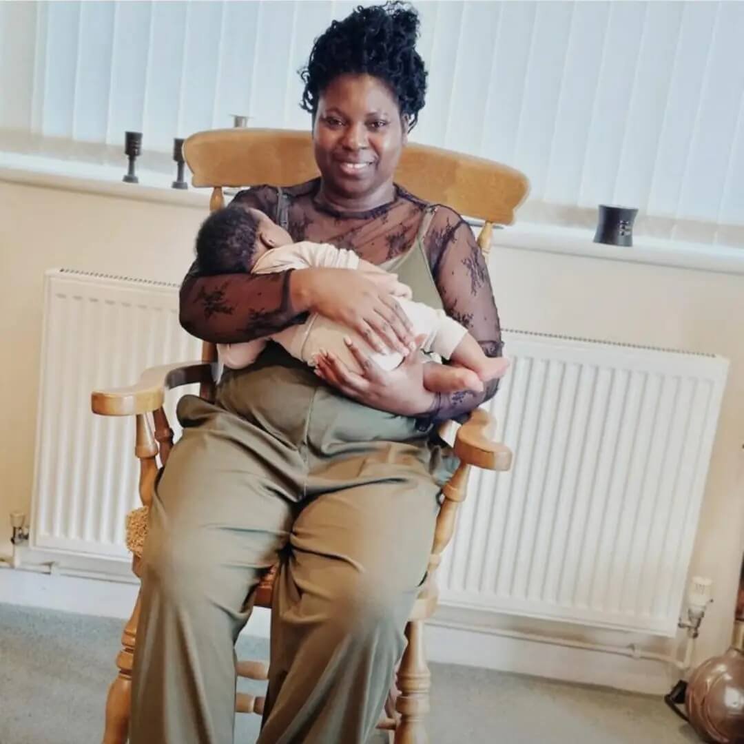 A mother holding her newborn